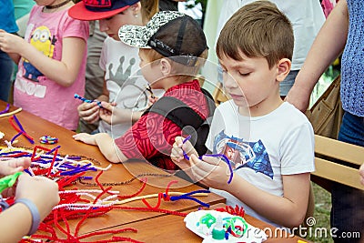 Children participating at art and craft outdoor workshop Editorial Stock Photo